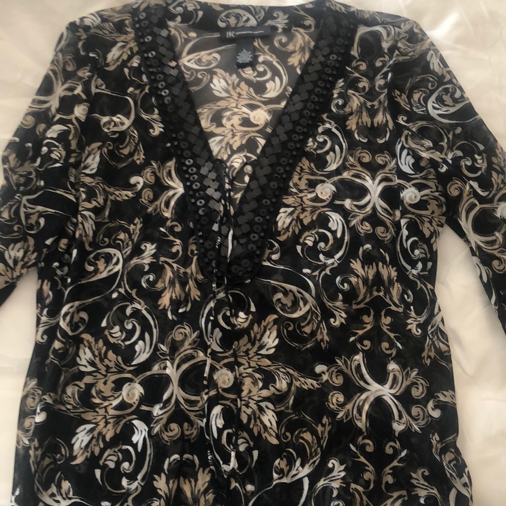 Sheer black INC top with black sequins detail.